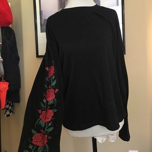 Black long sleeve with roses on sleeve